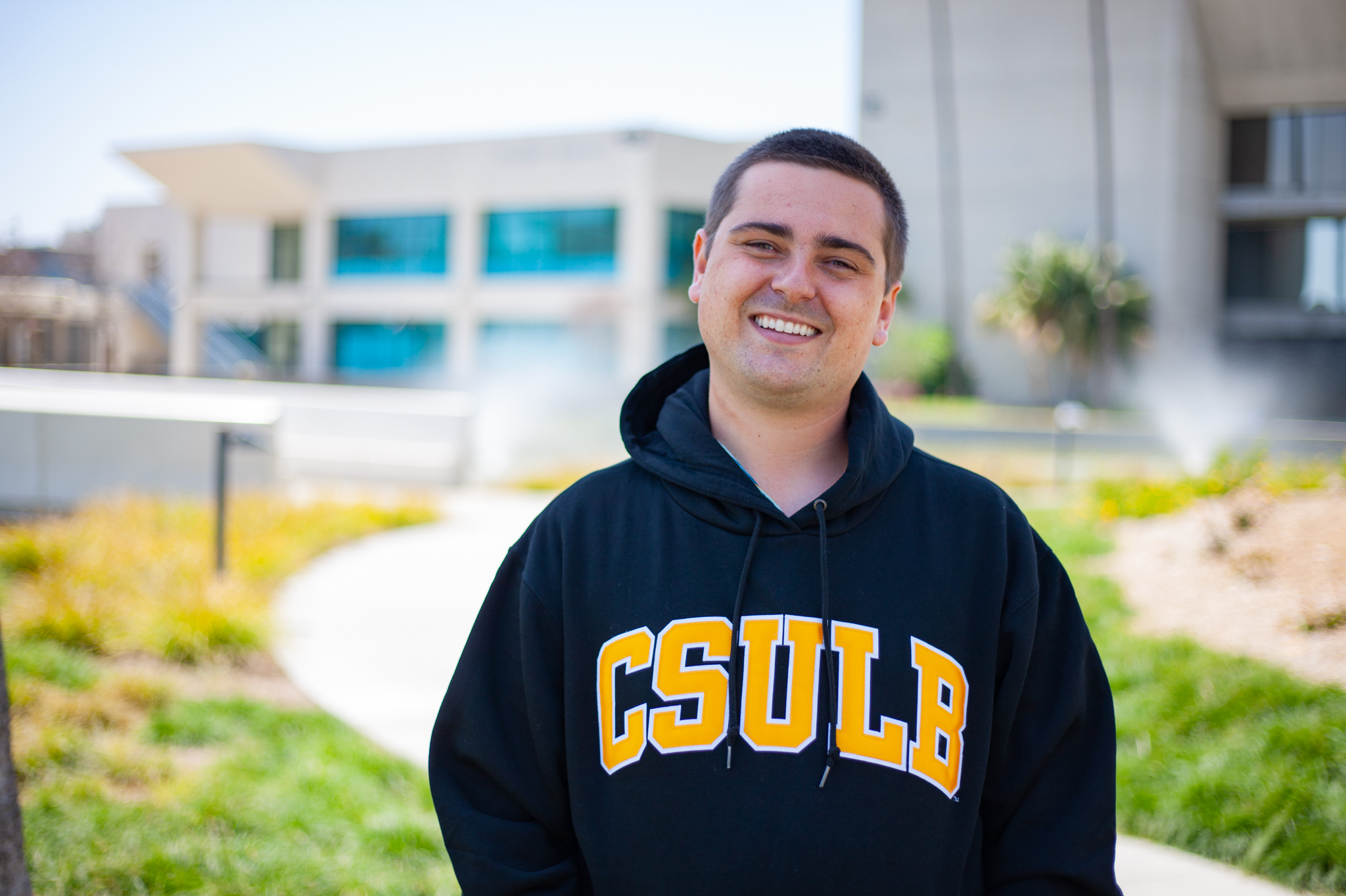 Student Paul Scott wears sweatshirt from CSULB where he will transfer in this fall. 