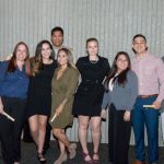 Group of Scholarship Award Ceremony attendees smiling.