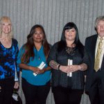 Group of Scholarship Award Ceremony attendees smiling.