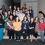 Group of Scholarship Award Ceremony attendees smiling.