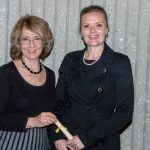 Gail Taylor and a young woman wearing black with a white pearl necklace.