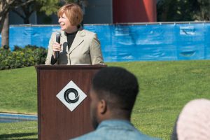 President, JoAnna Schilling speaking at podium