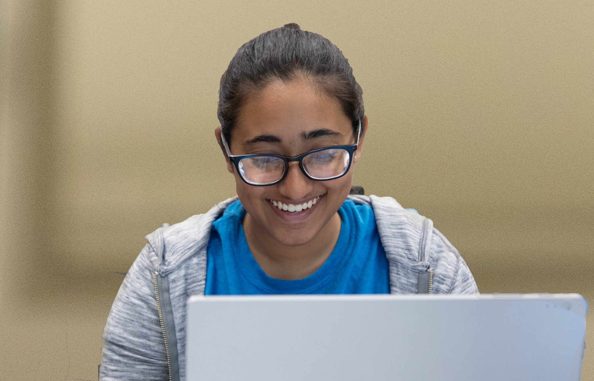 Student wearing glasses and looking 