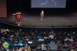 Dr. JoAnna Schilling speaks on stage to a theater full of guests at the 2018 Connect2Careers & Majors2Careers event.