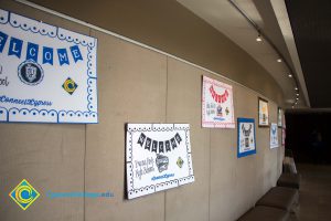 Wall with welcome posters for various local high schools.