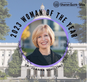 A photograph of Dr. JoAnna Schilling with the words "2023 Woman of the Year" and the logo for Assemblywoman Sharon Quirk-Silva