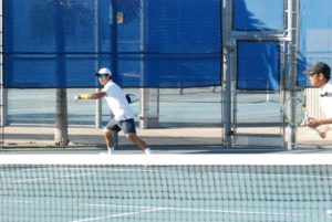 Men playing tennis